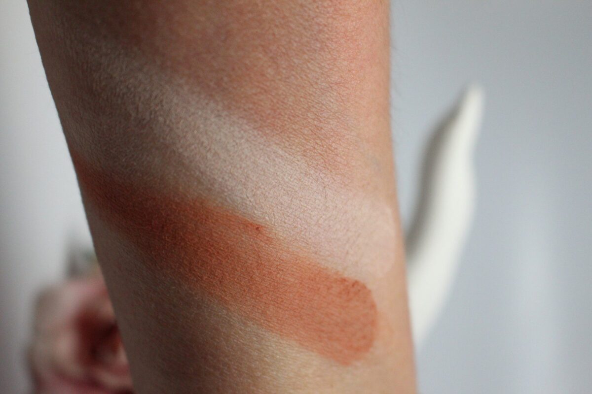 Under the highlight shade is a swatch of the deep ,bronze shade, which is great for contouring your cheeks, and your eyes for using it as a bronzer, and a blush