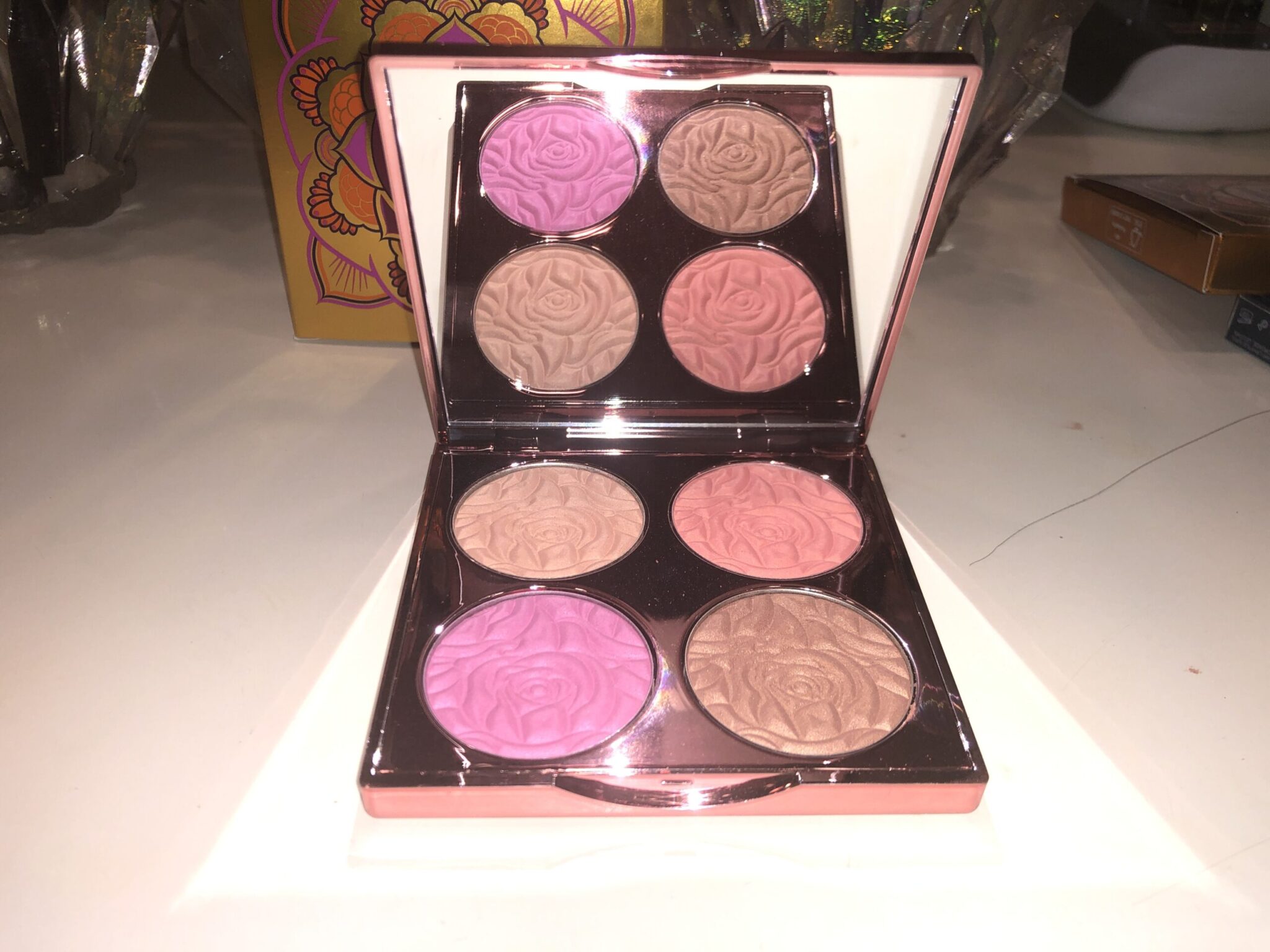 INSIDE THE BEACH BOMB PALETTE IS A MIRROR, AND FOUR PANS WITH EMBOSSED POWDERS