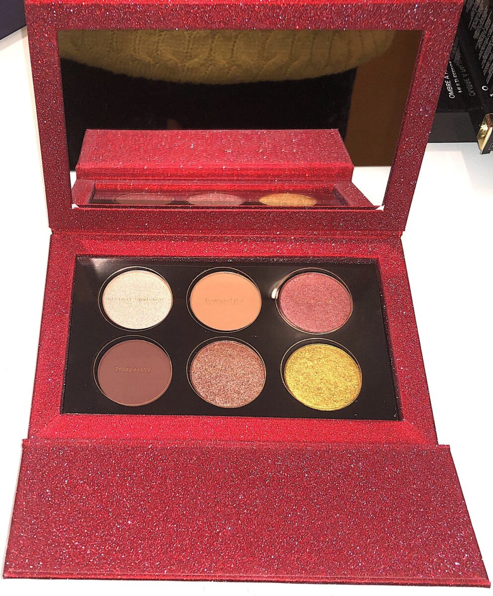 THE PAT MCGRATH GOLDEN OPULENCE EYE SHADOW PALETTE HAS A MIRROR AND SIX EYE SHADOW SHADES