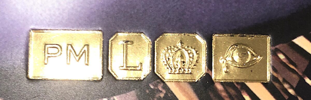 CLOSEUP OF THE GOLD STAMPS