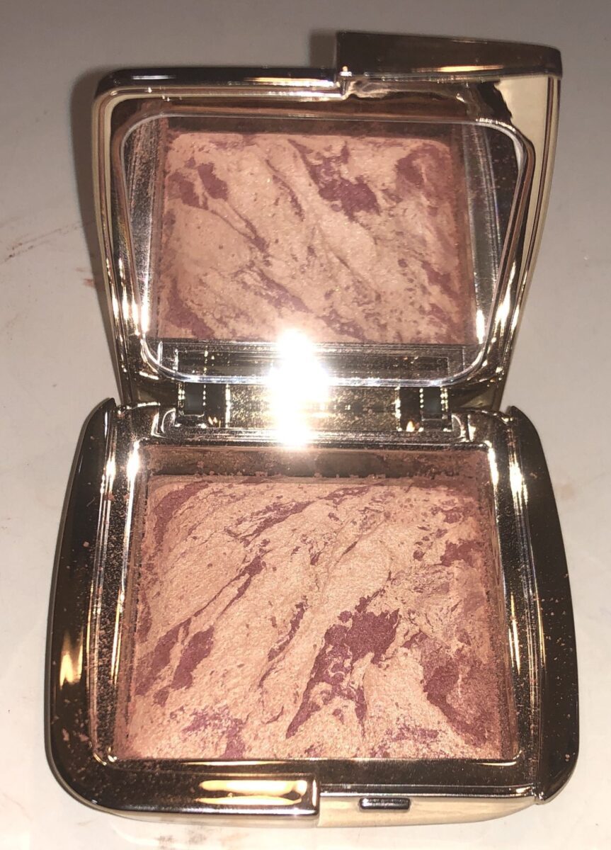 The Ambient Lighting Palette opened, has a large mirror on one side, and a large pan of blush on the other side