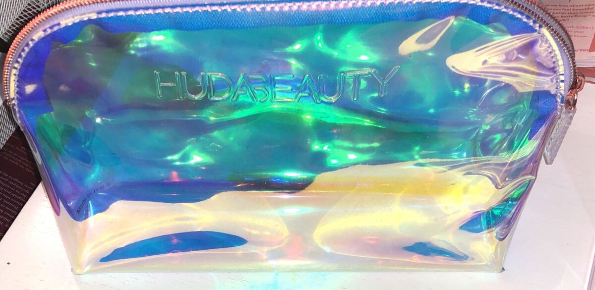 THE BRUSHES FOR THE HUDA MERCURY RETROGRADE COLLECTION COME PACKAGED IN A HOLOGRAPHIC MAKEUP BAG