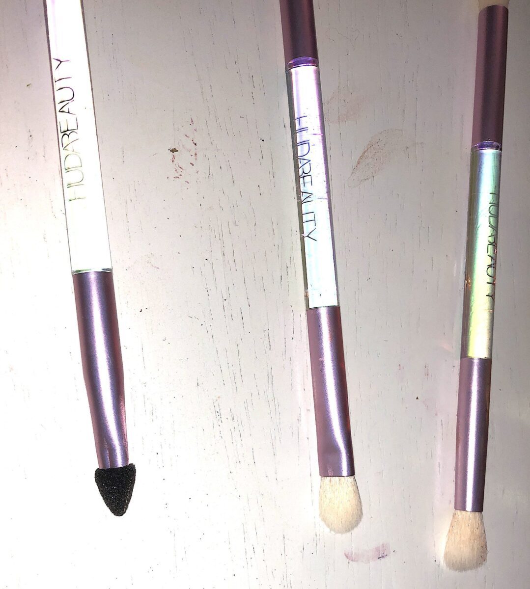 ONE SIDE OF THE HUDA MERCURY RETROGRADE COLLECTION'S DUAL -ENDED BRUSH SET