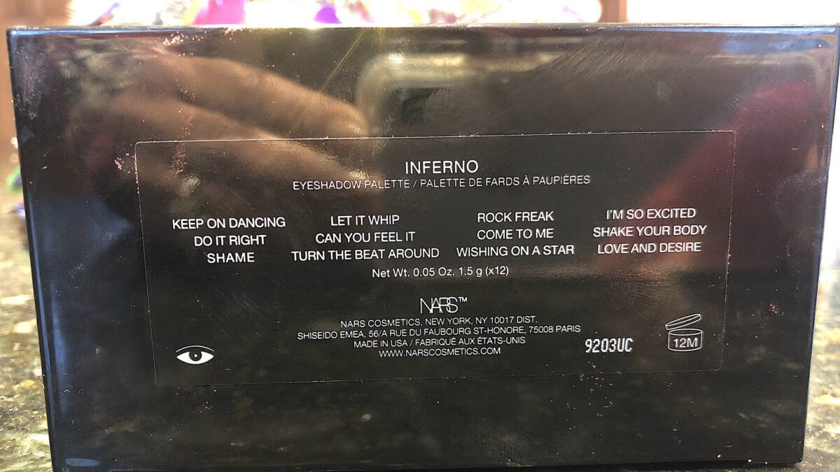 NARS STUDIO 54 INFERNO PALETTE WITH THE SHADE NAMES ON THE BACK OF THE COMPACT