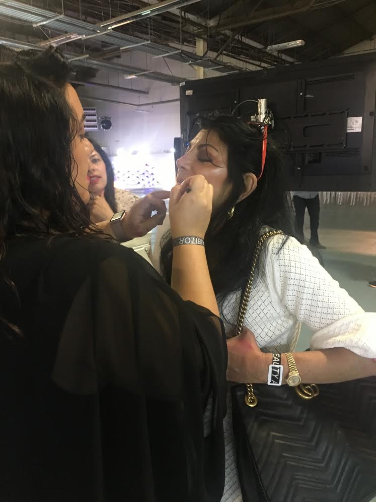 beautycon-sookie-getting-makeup-applied-at-flower