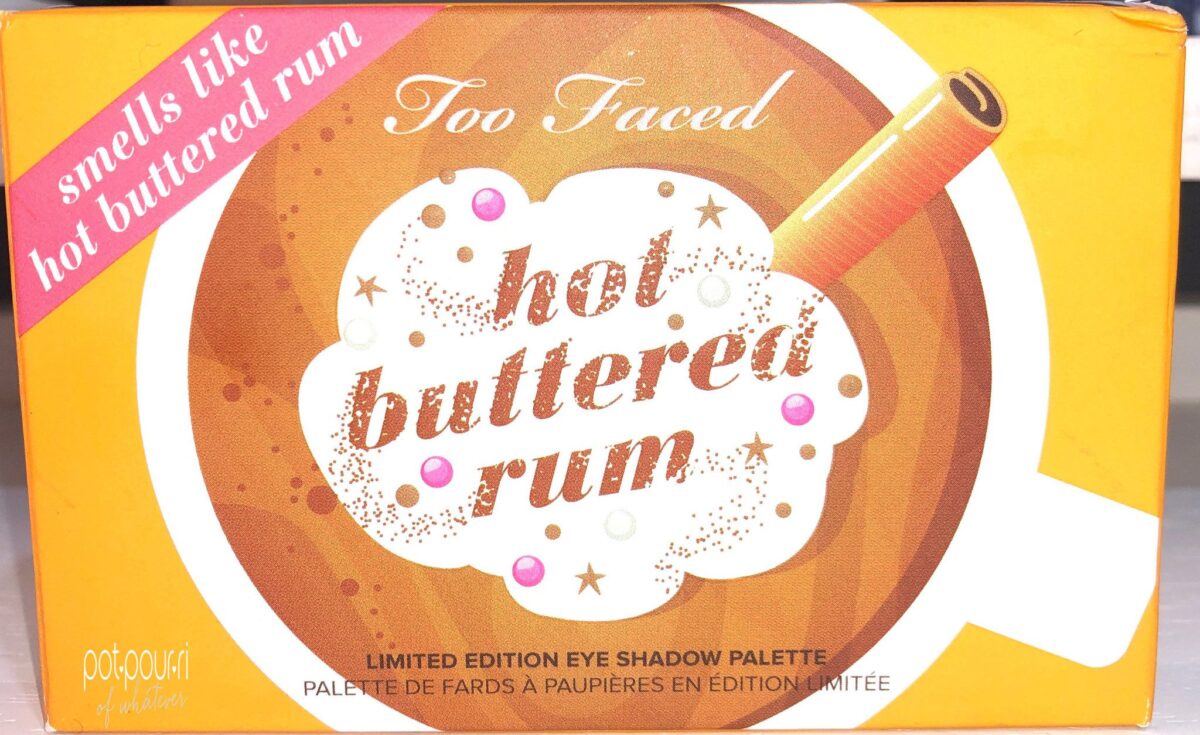 THE OUTER PACKAGING FOR THE TOO FACED HOT BUTTERED RUM MINI HOLIDAY EYESHADOW PALETTE