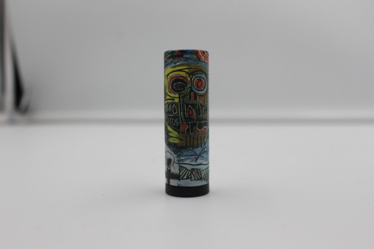 the lid to the lipsticks are also artwork done by Basquiat